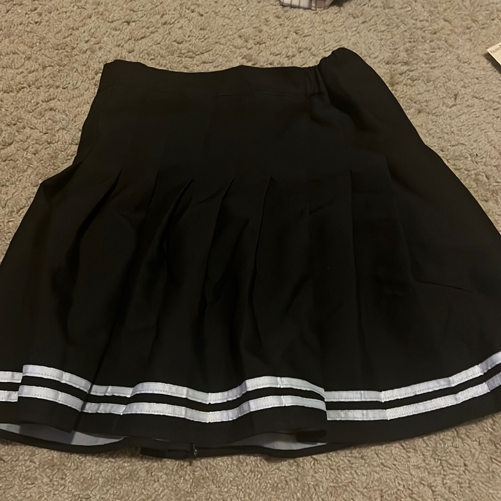 black and white skirt with shorts inside! says size L but fits more like a M